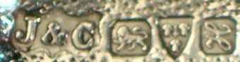 J&C into a shield  mark, Jones & Crompton -Edward Samuel Jones & Hubert Crompton-,  Chester  1908 