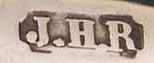 J.H.R into an oblong chamfered rectangle mark, John Horatio Risdon trading as Inderwick & Co, London 1908