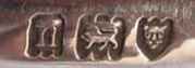J.H.R into an oblong chamfered rectangle mark, John Horatio Risdon trading as Inderwick & Co, London 1908