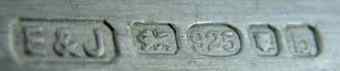 E&J into a chamfered rectangle mark, not identified, London 2001