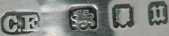 C.E into a chamfered rectangle mark, not identified, London 1935