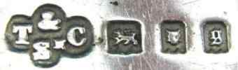 T & C over Sn into a quatrefoil mark, Thomas Callow & Son, London 1922