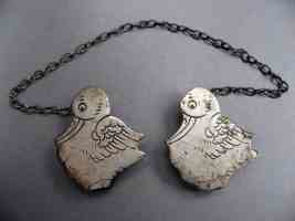figural sterling silver baby bib holder