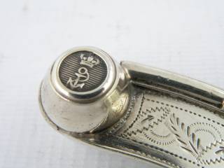 the metal sphere (the buoy) in a silver bosun whistle
