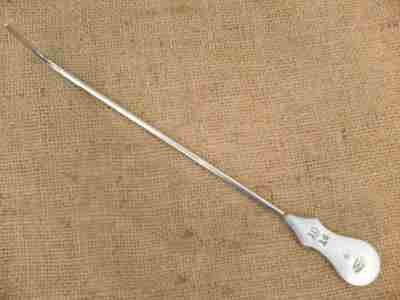 broad arrow on a medical instrument