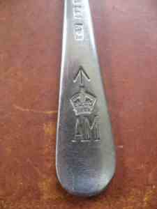 broad arrow on a silverplate spoon