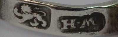 mark of William Harrison I, London c. 1758 on a silver tea tong with Allanson family crest