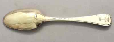 silver spoon with family crest: ASHBURNHAM