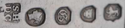 Hayne & Cater hallmark on a set of forks with BARTHOLOMEW or BARTOLOMEW family crest