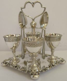 egg-cup frame with four egg-cups and spoons