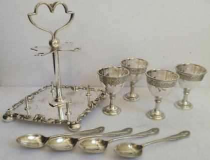 egg-cup frame with four egg-cups and spoons