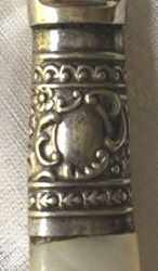 silverplate ferrule on knife with mother-of-pearl handle