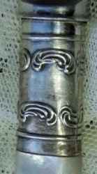 silverplate ferrule on knife with mother-of-pearl handle