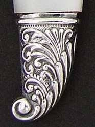 silverplate cap on knife with mother-of-pearl handle