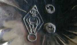 figural trade mark (Atlas) in a sterling silver object