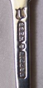 Mappin & Webb, silver plate mark, lowercase 'j' date letter, on a silver jubilee spoon 1910-1935