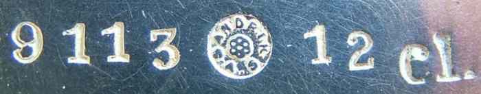 An inscription on the creamer bottom with the Sandrik mark  