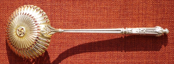 A silver-plated spoon for sugar powder made of nickel silver before 1902