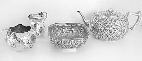 teaset: sugar bowl, milk creamer, waste bowl, teapot