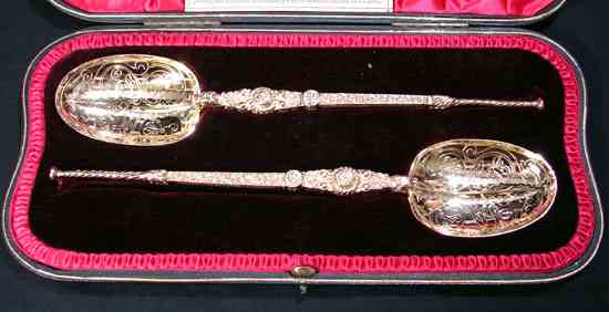 pair of cased anointing spoons: 1899