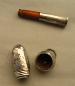 silver acorn containing a cigarette-holder