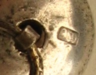 silver acorn containing a cigarette-holder