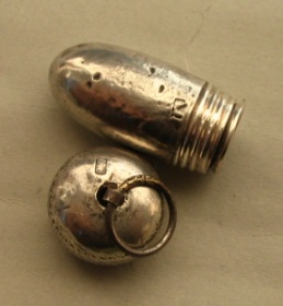 silver acorn containing a cigarette-holder