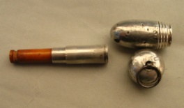 silver acorn containing a cigarette-holder