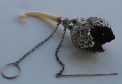 Posy holder was attached to lady's hand by a chain and a ring 