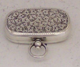 silver sovereign holder in locket shape