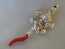 silver baby rattle and whistle
