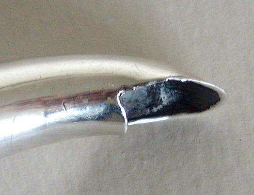 curved end of the spout curved end of the spout