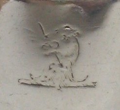 family crest: lion's head stabbed by an arrow